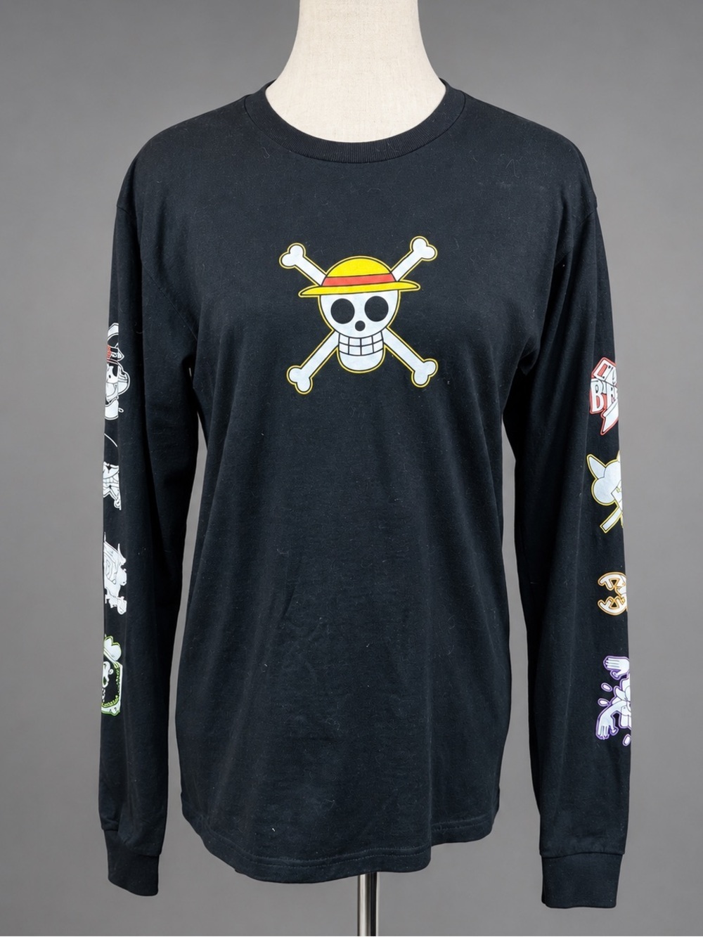 One piece size, small black, skull cross bones graphics, long sleeve T-s…